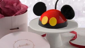 close up of disney themed birthday cake at Amorette's Patisserie Disney Springs in Orlando, Florida, USA